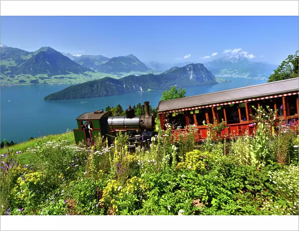 steam railway climbing Mount Rigi, Lake Lucerne, Burgenstock mountain and Pilatus mountain at the back, Vitznau, Canton of Lucerne, Switzerland