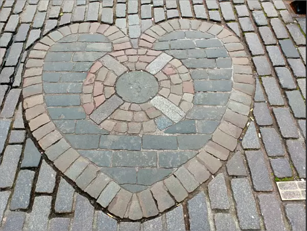 Heart of Midlothian, paving stones mosaic in front of St. Giles Cathedral, High Street, Royal Mile, Edinburgh, Scotland, United Kingdom