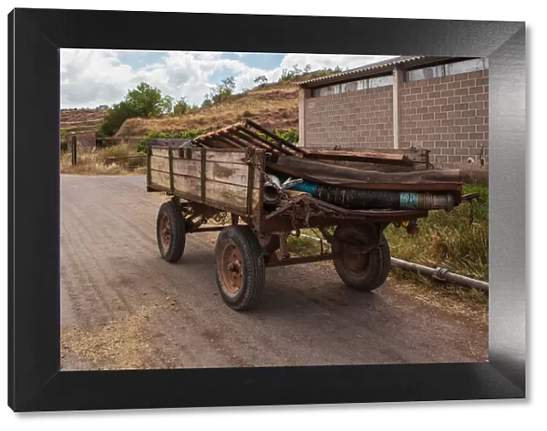 Old cart on a quite road, La Rioja, Spain