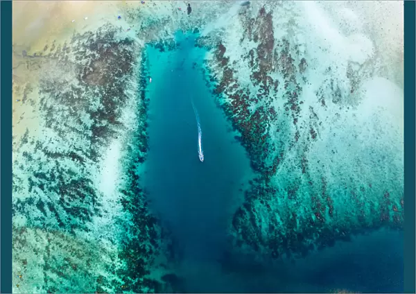 Aerial view of motorboat in the turquoise sea, Thailand