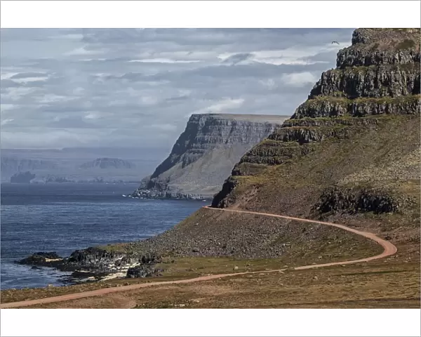 Rocky coast with road 612, near Latrabjarg, Westfjorde, Iceland