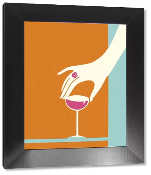 Hand Reaching for a Wineglass