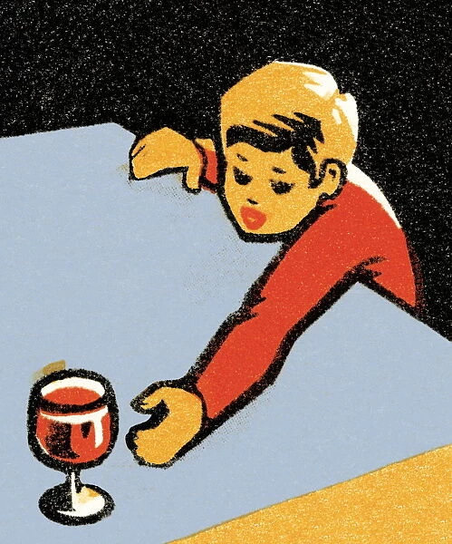 Boy reaching for wine