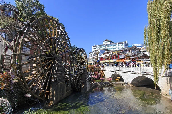 Bridge and Water wheels at the entrance on Lijiang Old Town in Yunnan
