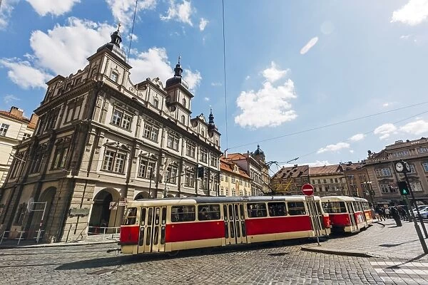 Classic red tram on the streets of Lesser town (Mala Strana) in Prague, Czech Republic