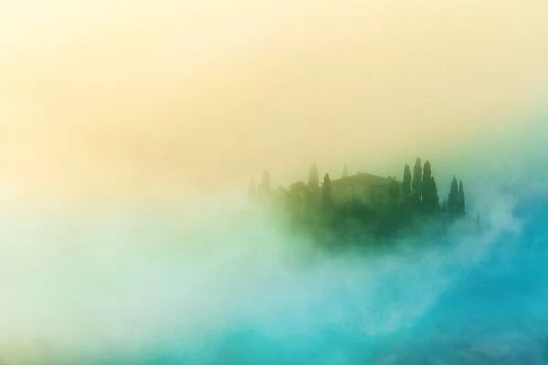Farmhouse in the morning fog in Tuscany, Italy