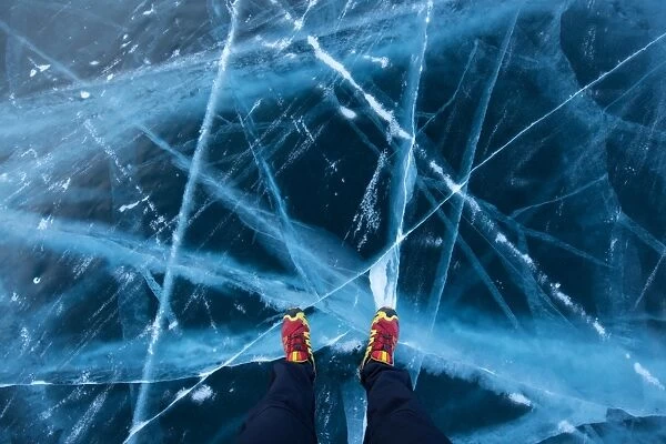 Feet on the frozen Bailkal lake