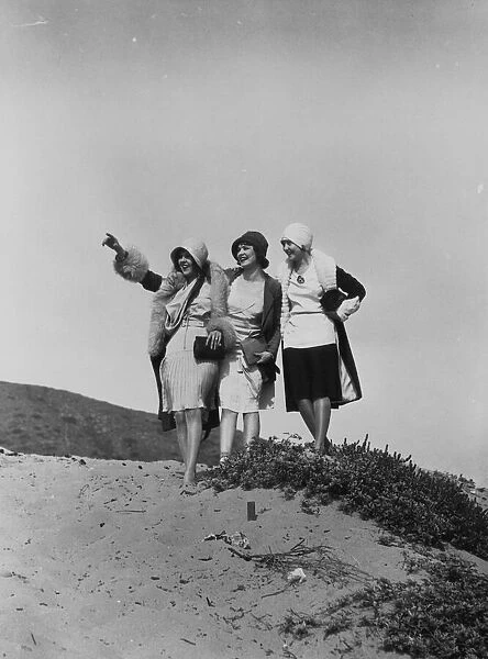 Flappers. circa 1928: A group of flappers on a beach