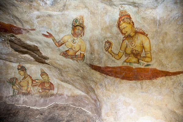 Frescoes depicting bared chested women talking