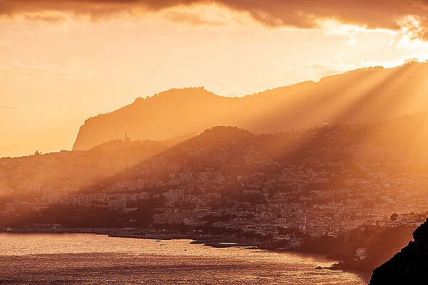 Funchal city skyline and Madeira island landscape at sunset, Portugal