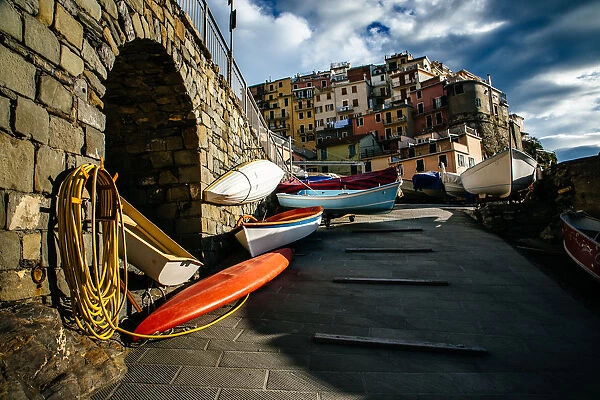 Kayaks with colorful houses of Manarola village in Cinque Terre National Park, Liguria, Italy