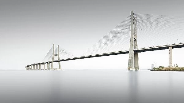 Minimalist long exposure of the famous Ponte Vasco da Gama bridge over the Tagus in Lisbon, Portugal