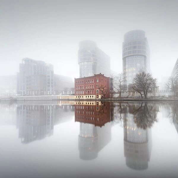 Minimalist long exposure of the former Ministry of the Interior on the Spree in thick morning fog in Moabit, Berlin, Germany, Europe