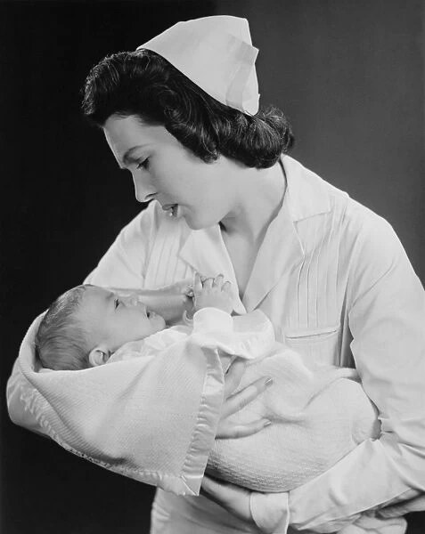 Nurse holding crying baby (B&W)
