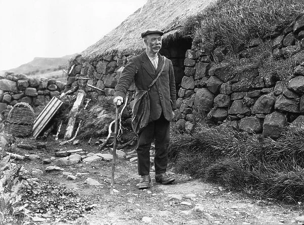 Postman. 1928: A postman on the Isle of Skye in north western Scotland
