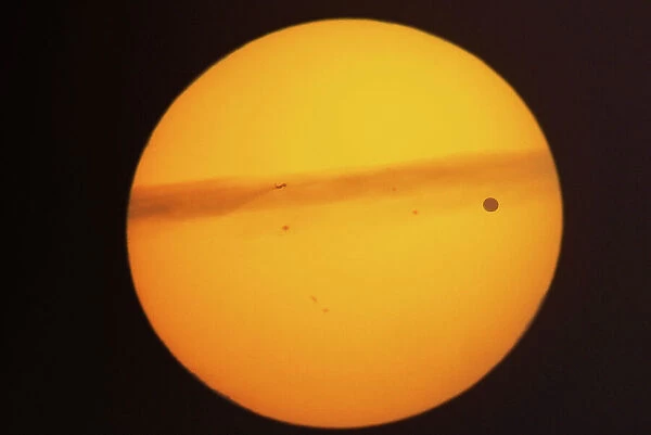 Rare transit of the planet Venus across the face of the sun that took place on June 5, 2012. The sun was close to the horizon and in addition to the silhouette of Venus