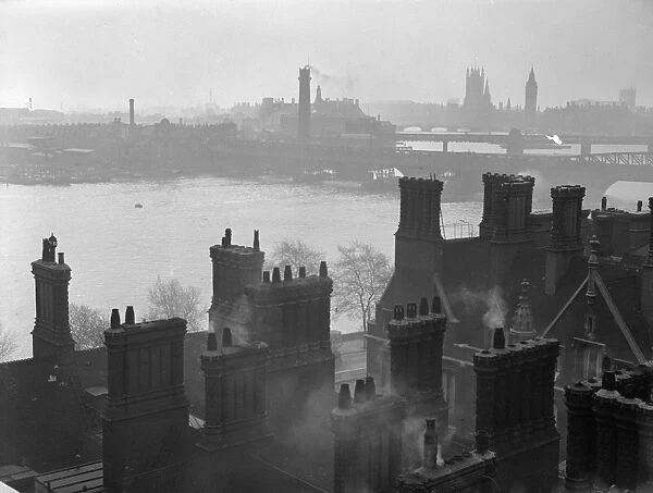 Riverside. circa 1930: Buildings along the banks of the River Thames in London