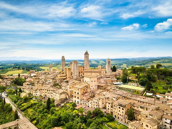 San Gimignano from above, aerial view from town to country. Tuscany, Italy