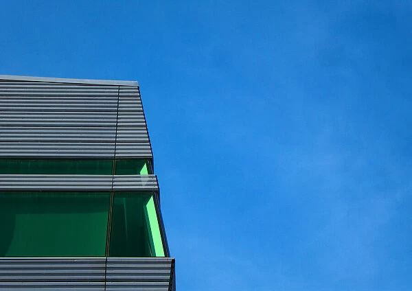 Steel Sky. A color photograph of a new metallic commercial building in downtown Portland