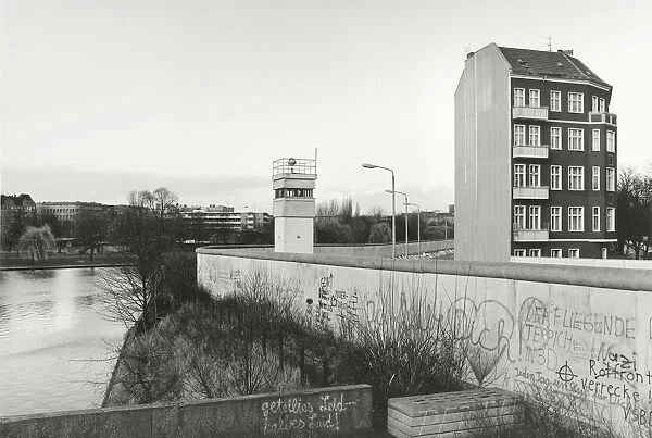 View over the Berlin Wall in 1985, detached house next to a watchtower adjacent to the inner German border, known as the Death Strip, Berlin, Germany, Europe