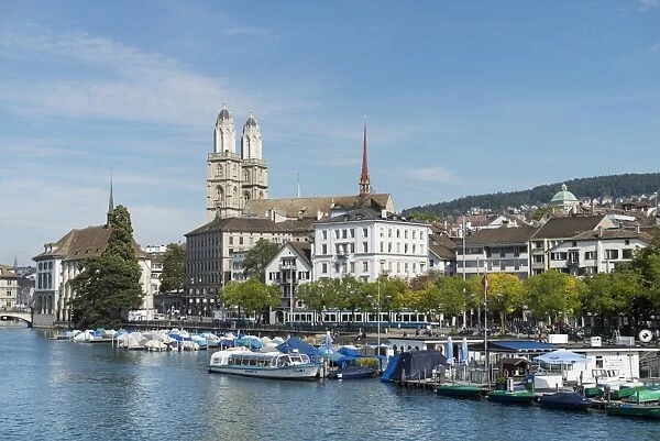View from Quaibruecke bridge over the Limmat river to the marina with the Limmat quay, the twin towers of the Grossmuenster church at back, Zurich, Canton of Zurich, Switzerland, Europe