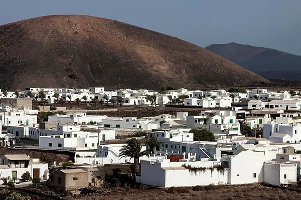 White buildings, volcanoes at the back, Uga, Lanzarote, Canary Islands, Spain
