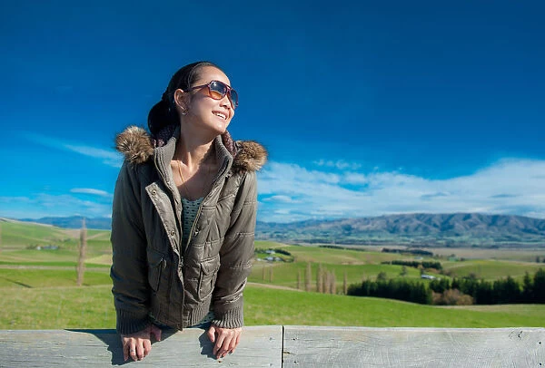 Woman smile with hilly landscape background