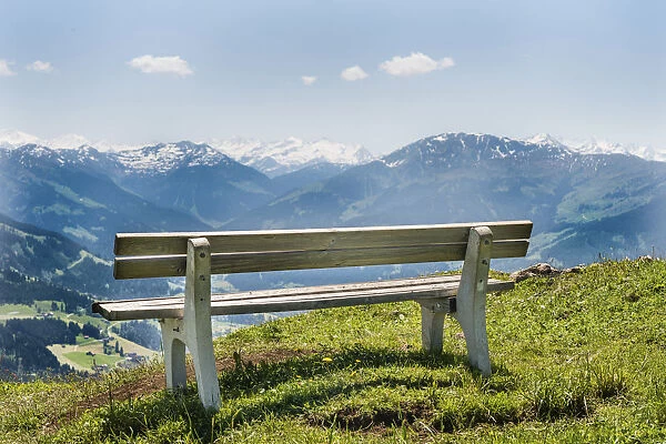 Wooden bench with views of the Alps, Brixen im Thale, Tyrol Austria
