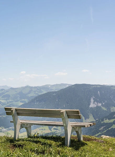 Wooden bench with views of the Alps, Brixen im Thale, Tyrol Austria