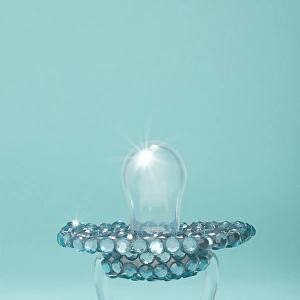 aby pacifier covered in diamonds on blue