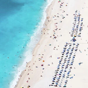 Aerial view of famous Myrtos beach crowded with tourists in summer, Greece