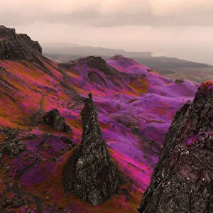 Fantasy aerial picture above the dramatic landscape with infrared colors in Scotland