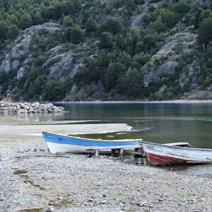 Fishing boats on the shore of Lago Bertrand at the mouth of Baker River, Bertrand, Aysen, Chile