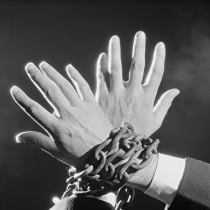 Hands chained together
