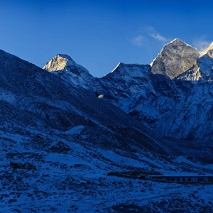 Top of himalayan mountain range with sunrise