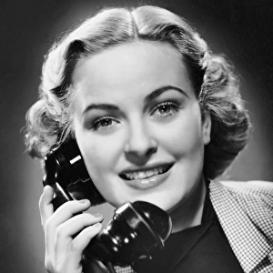 Indoor portrait of woman on telephone