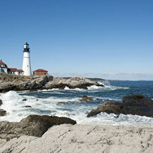 Lighthouse, waves breaking on rocks, Portland Head Light, Cape Elizabeth, Portland, Maine, New England, USA, North America