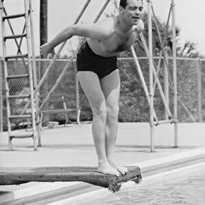 Man standing on diving board, preparing to dive (B&W)