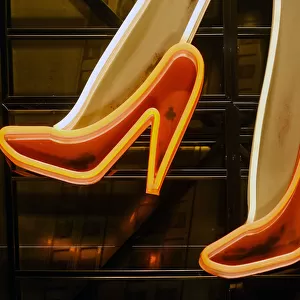 Part of neon light sign, red high heels