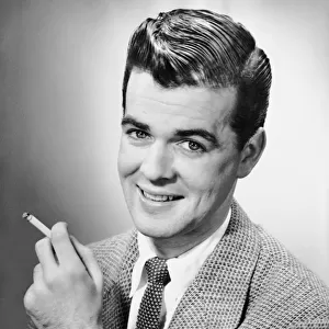 Portrait of man holding a cigarette