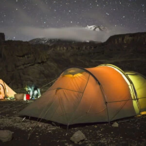 Scenic view of tents under starry sky from Moir Huts Camp, alpine zone, Mount Kilimanjaro, Kilimanjaro Region, Tanzania