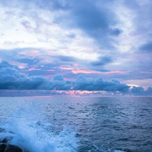 Wave splash at sunset, Dinawan Island, Sabah, Borneo