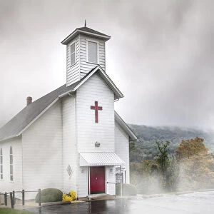 White church in the misty mountains