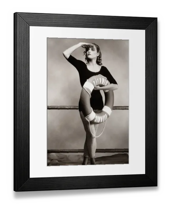 Framed Print : Woman in bathing costume holding life preserver Framed Print : Woman in bathing costume holding life preserver