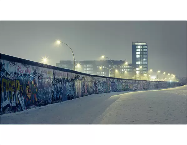 Berlin wall at winter with mist an nightlights