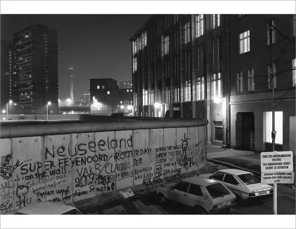 View over the Berlin Wall in 1985, towards the TV Tower at Alexanderplatz in East Berlin, at night, Berlin, Germany, Europe