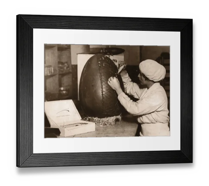 Framed Print : Woman Decorating Fifteen Pound Chocolate Easter egg (B&W sepia) Framed Print : Woman Decorating Fifteen Pound Chocolate Easter egg (B&W sepia)