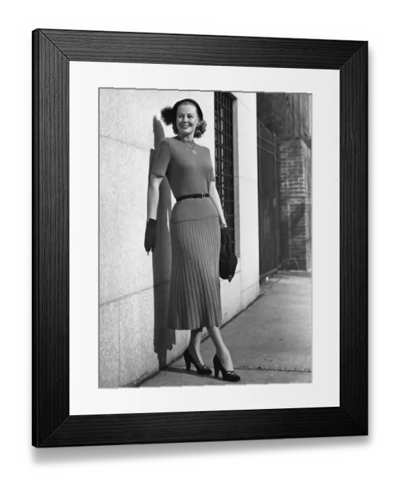 Framed Print : Woman outdoors leaning on building Framed Print : Woman outdoors leaning on building
