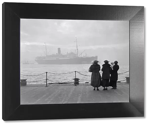 Laconia. Three ladies watch the second Cunard liner to be named Laconia