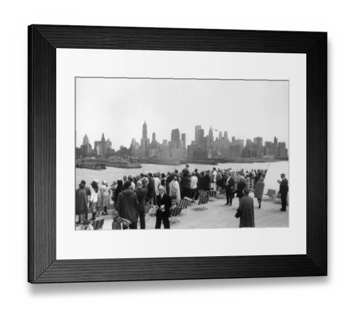 Framed Print : Landfall. Passengers on the QE2 line the rails as the ship arrives in New York